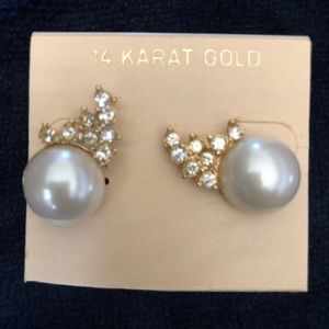 Pearl and faux diamond earrings.